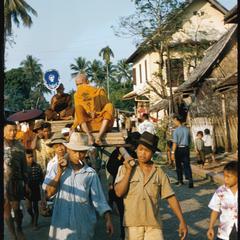 Carrying monk on palanquin