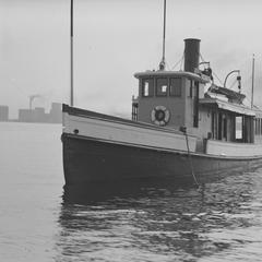 Tug Ellen D. with Rowboat Alongside