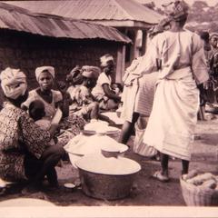 Women at market selling gari