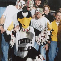 Fans with painted faces at men's basketball game with Phoenix mascot