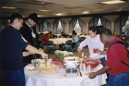 Students getting food during the 2003 Student of Color Connection