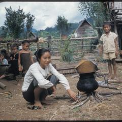 Lao woman steaming rice