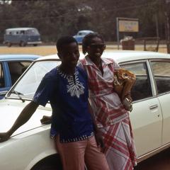 Nike (Komolafe) Afolabi and man by vehicle