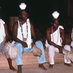 Men Seated with Pots on Heads During Etafa Ceremony