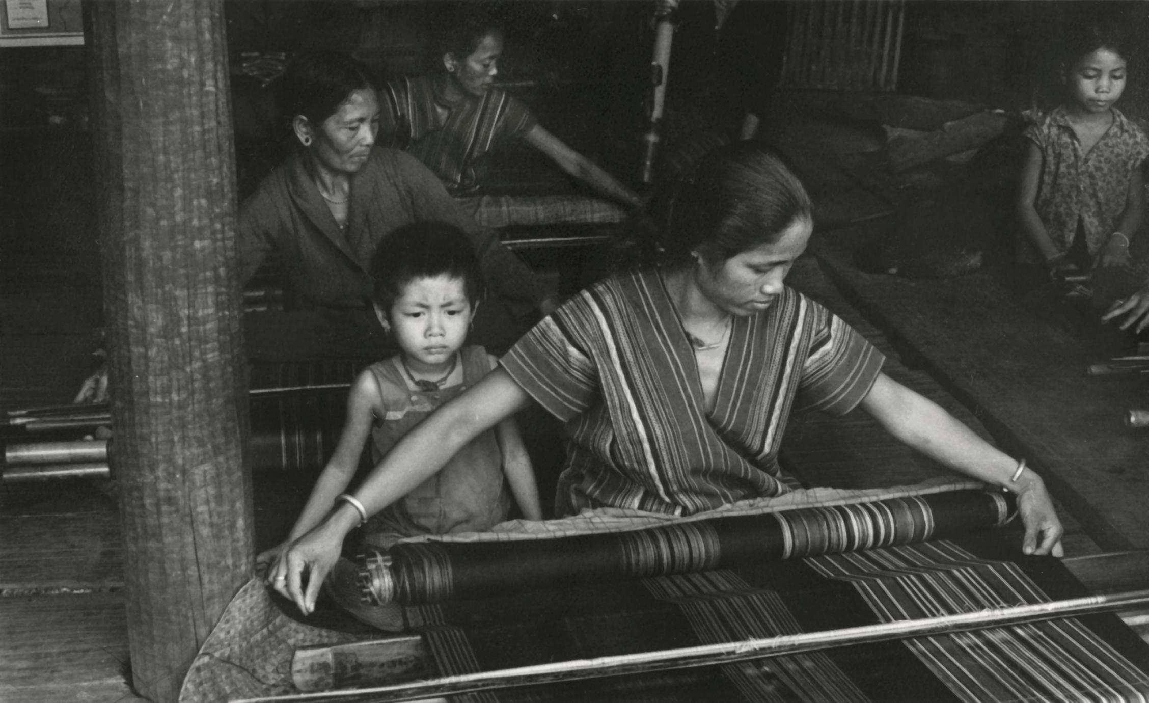 Alak women weaving cloth in Attapu Province