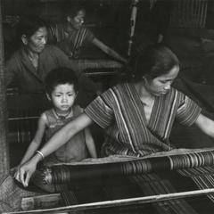 Alak women weaving cloth in Attapu Province