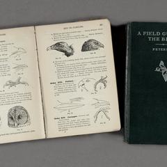 Aldo Leopold's Copy of Roger Tory Peterson's A Field Guide to the Birds (closed) and Frank M. Chapman's Handbook of Birds of Eastern North America (open)