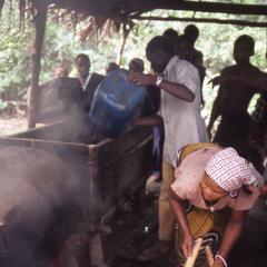People at stove making ogogoro