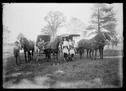 Horse drawn buggies and families