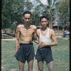 Two Kammu (Khmu') men with tattoos