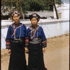 Two girls in Yunnanese dress