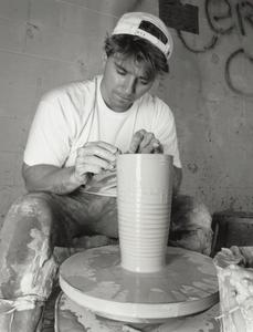 Student using a potter's wheel