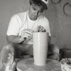 Student using a potter's wheel