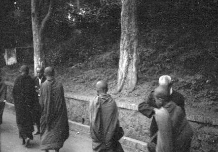 Morning laymen standing, providing food for monks