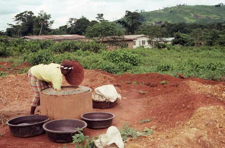 Woman getting water from well