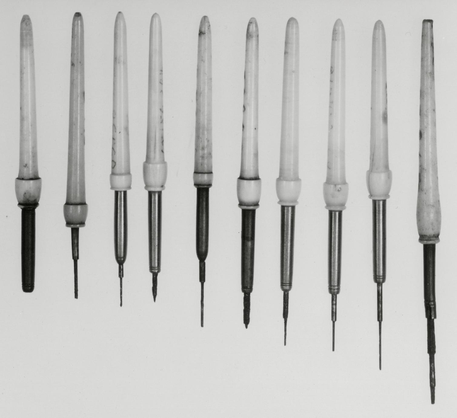 Black and white photograph of pivot hole drills.