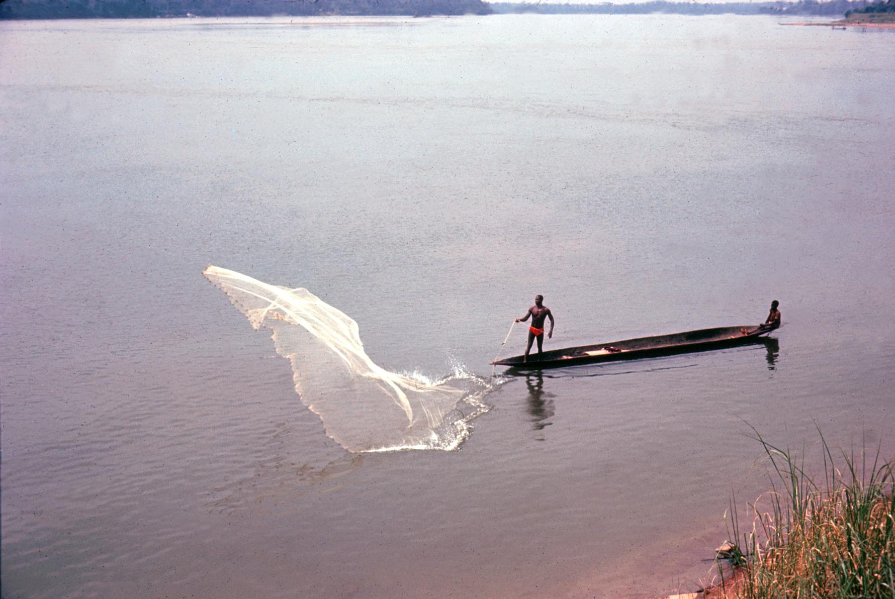 Fisherman Casting Net on the Ubangi River - UWDC - UW-Madison