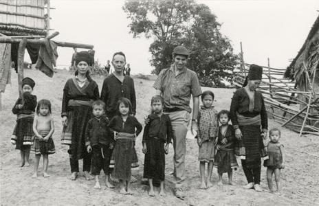 Jacques Lemoine, well-known French anthropologist, stands with Blue Hmong (Hmong Njua) villagers in a Blue Hmong village in the area of Muang Vang Vieng in Vientiane Province