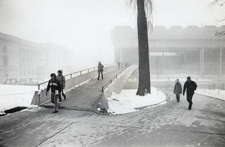 Students walk across the Park Street pedestrian bridge