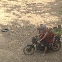 Man with kids on a motorcycle