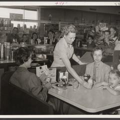 Shoppers eat at a drugstore lunch counter