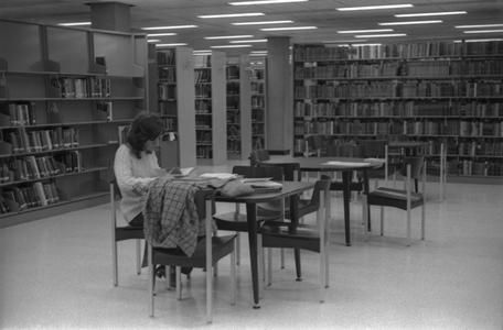 Student in the Jim Dan Hill Library