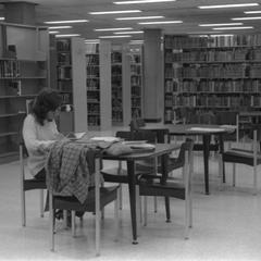Student in the Jim Dan Hill Library
