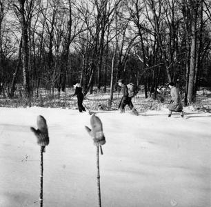 Estella Jr., Aldo Leopold, and Estella walking to the shack in snow
