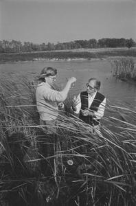 Professor Paul Sager and student collecting water samples