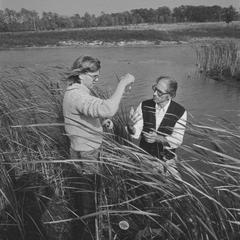 Professor Paul Sager and student collecting water samples