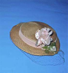 Straw hat with pink veil