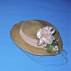 Straw hat with pink veil