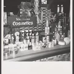 A drugstore window display on vacation cosmetics