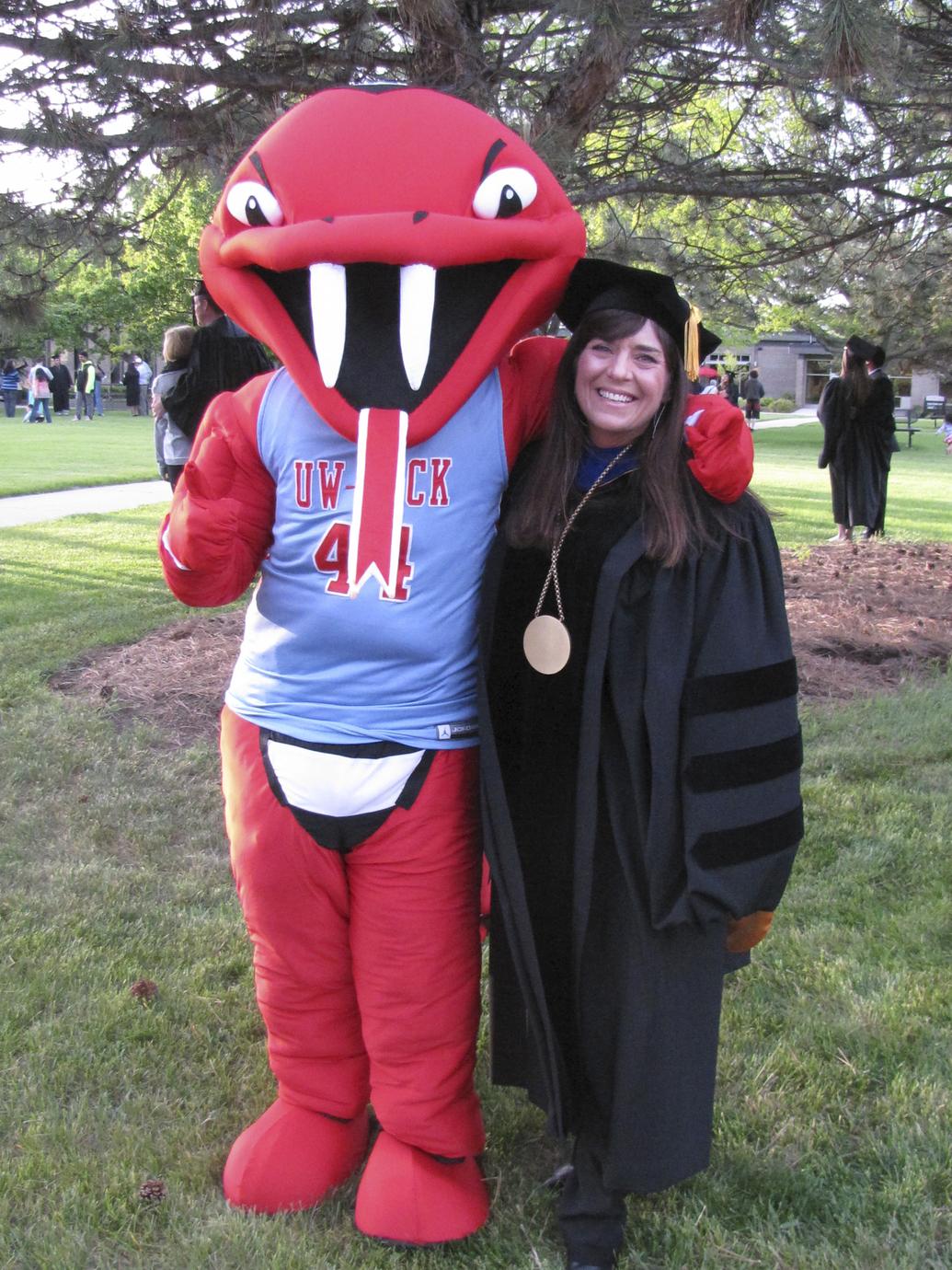 Carmen Wilson and Rocky the Rattler, Commencement, Janesville, 2015 - UWDC  - UW-Madison Libraries