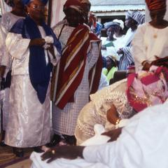 Bride kneeling for parents