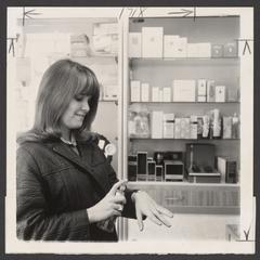 A young woman tests a new perfume