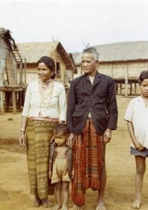 A village headman, his wife and sons pose for a photograph in Attapu Province