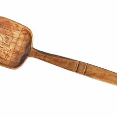 Object 1 titled Wooden spoon with chicken depiction