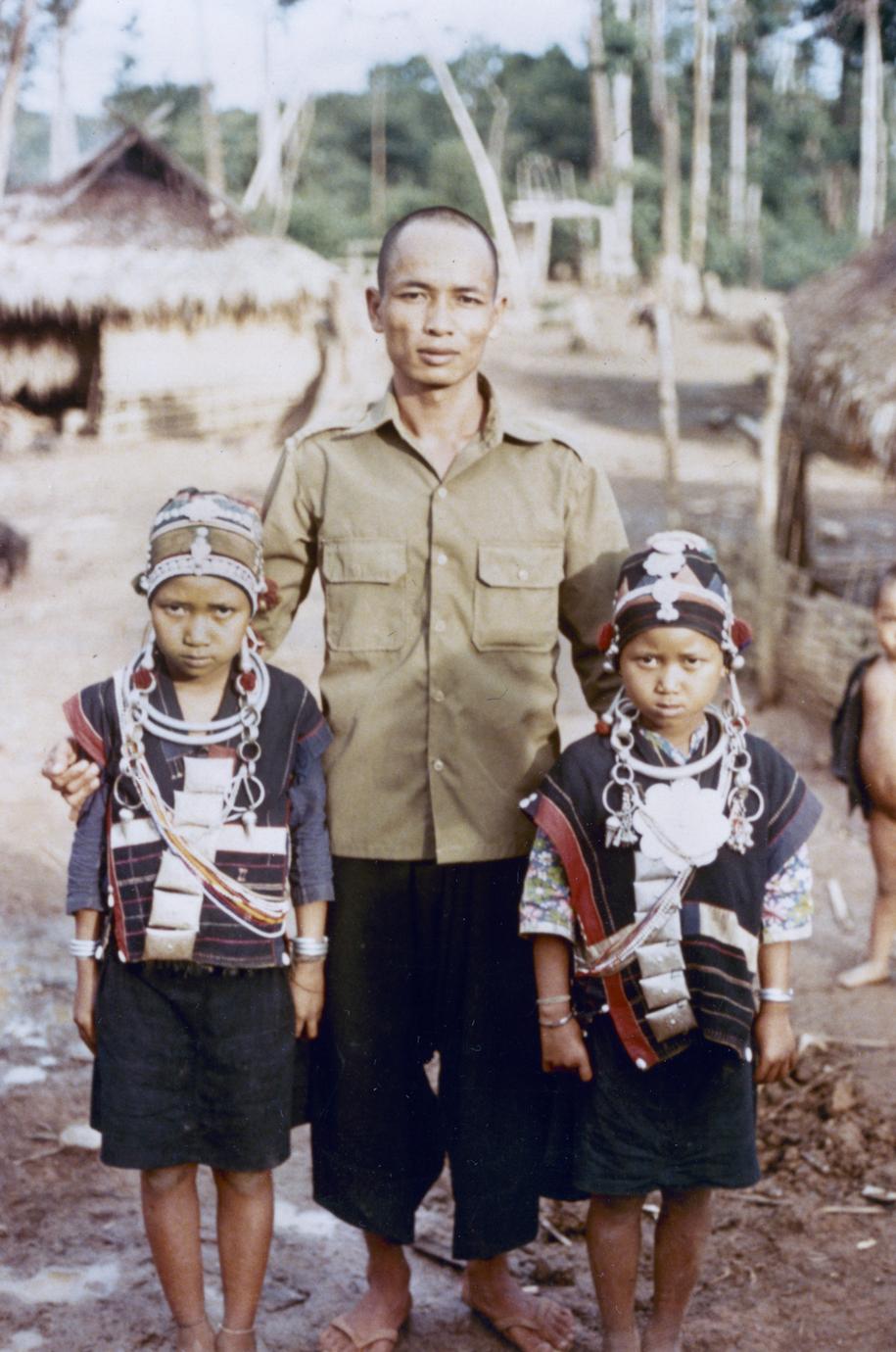 Akha children with their father in the village of Phate in Houa Khong Province