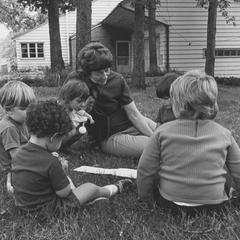 Dorothy Parsons outside with a group of children