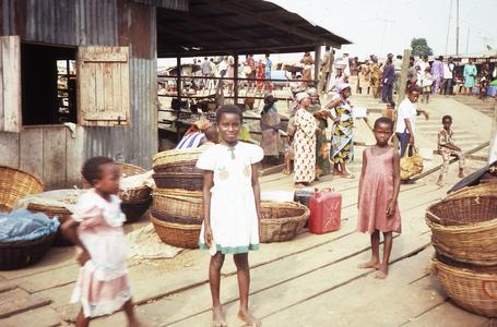 Children in front of fish shed