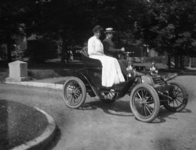 Man and woman riding in car