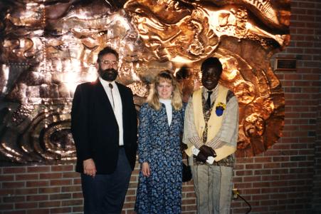 Agbo Folarin and others in front of his mural, "Creation of Diversity Myth's"