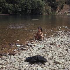 Child playing in river