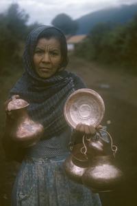 Local woman with copperware, Santa Clara de Cobre