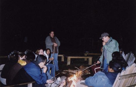 Students around a campfire