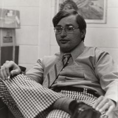 Theatre professor Doug Rosentrater sitting at his desk