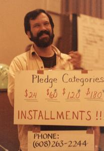 Jim Fleming with pledge drive sign