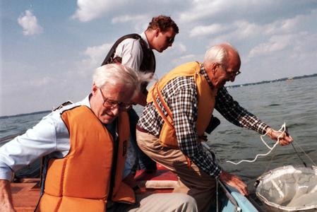 Arthur Hasler, John Foley, and Fritz von Siegfried collecting plankton samples