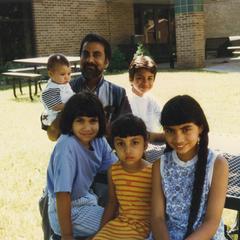 Economics professor Larry Gomes and children